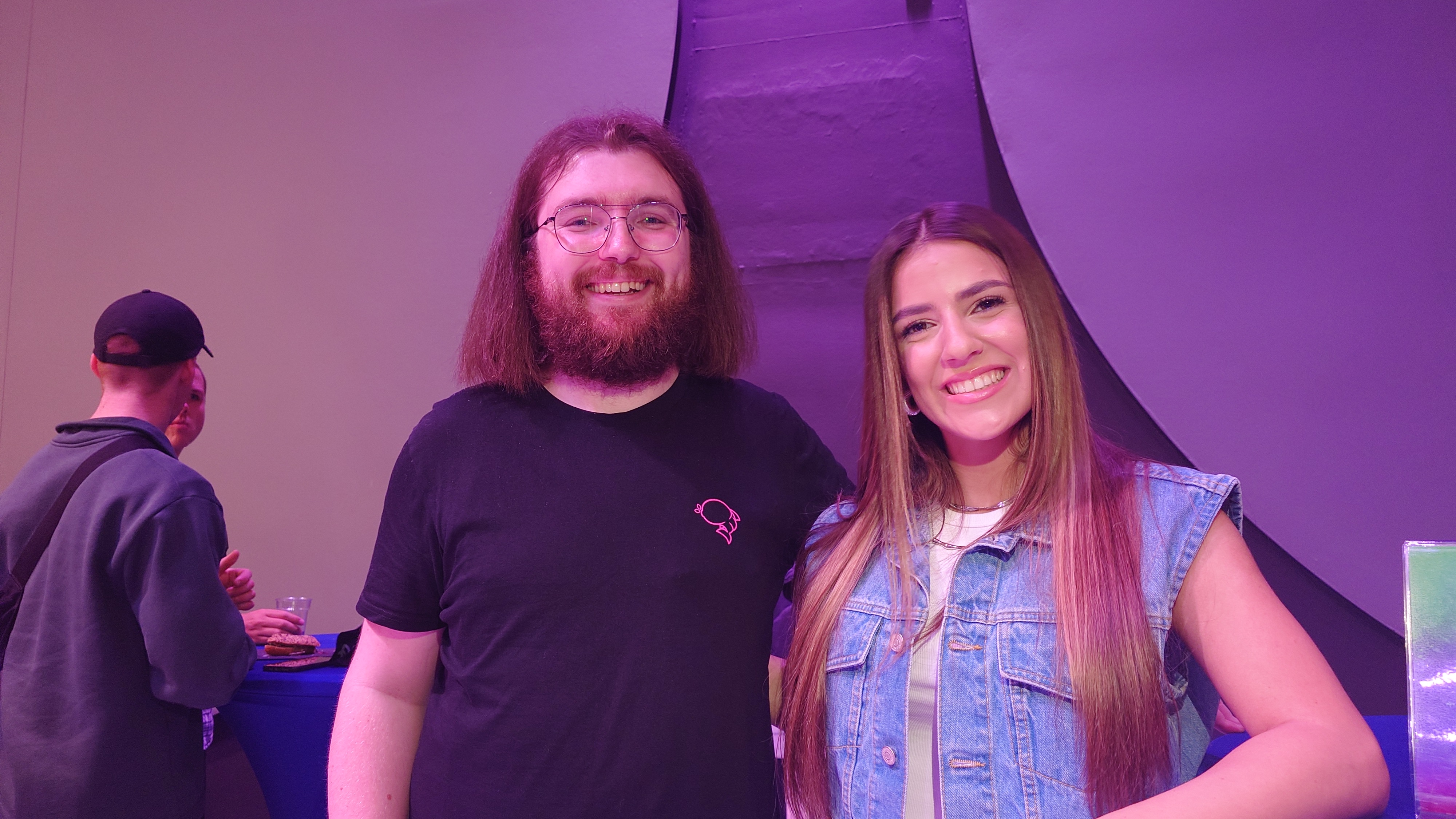 Silia Kapsis and Angus standing next to each other, smiling at the camera