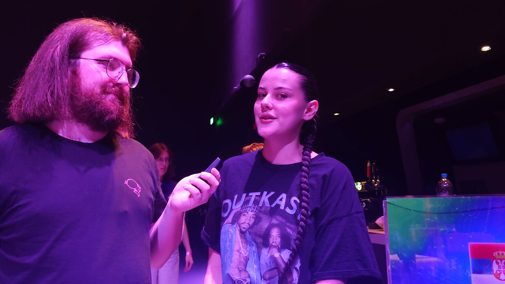 A still of Teya Dora being interviewed by Angus at Eurovision in Concert