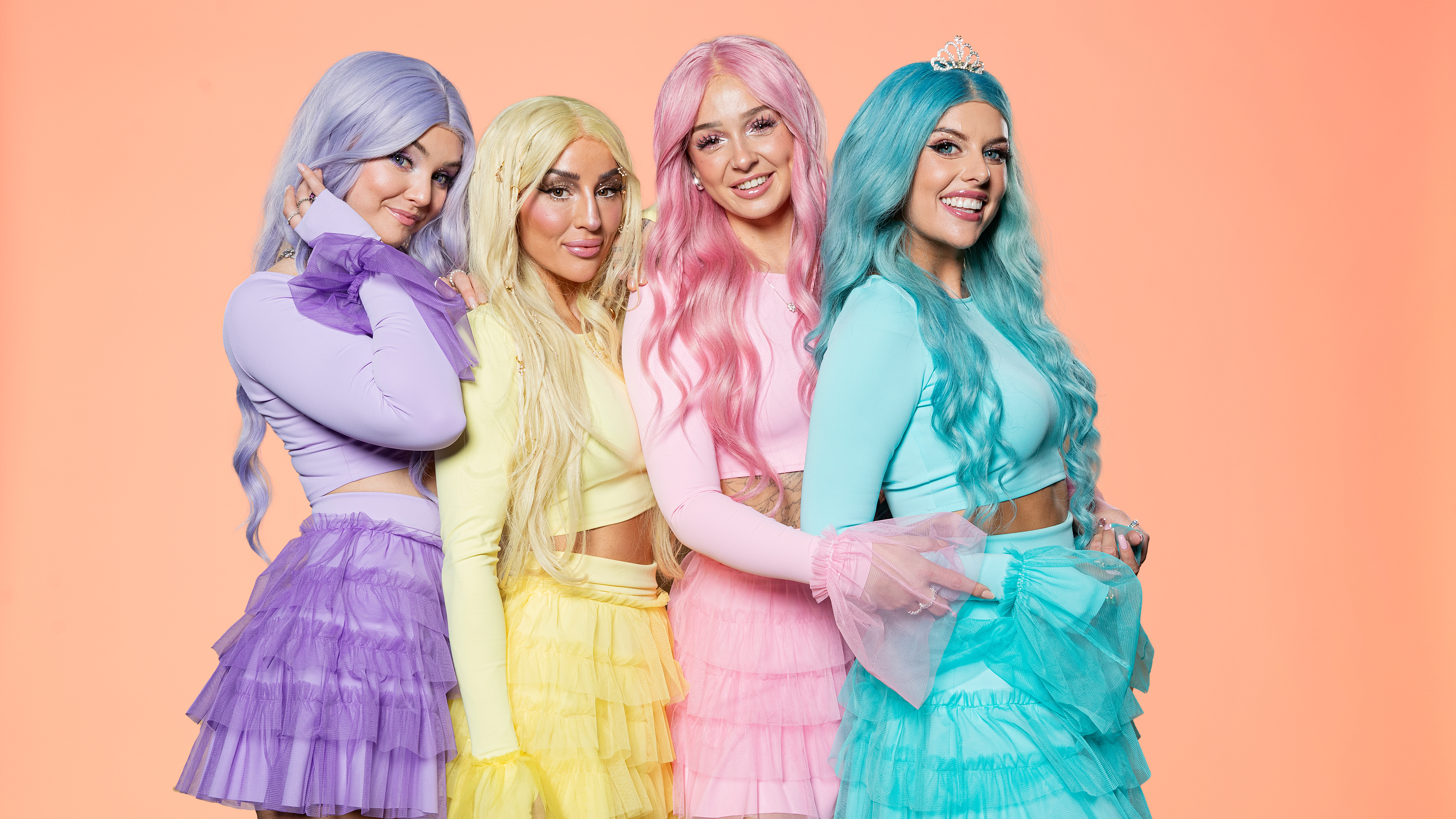 Dolly Style, wearing their purple/Yellow/Pink/Blue outfit colours