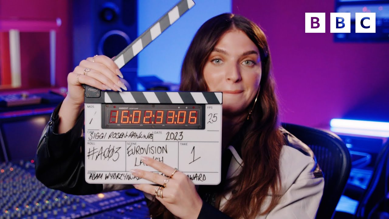 mae muller holding a clapper board