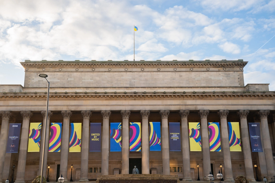 an image of st. george's hall in liverpool with eurovision banners hanging from it